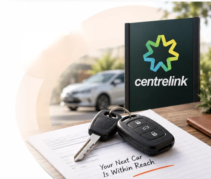 Car keys on loan papers beside a Centrelink sign